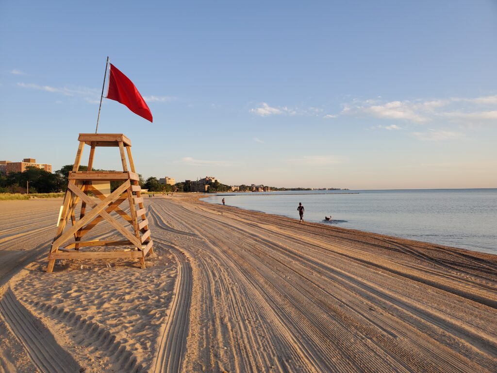Beach sand groomed at Loyola Beach makes it visually inviting for joggers, dog walkers, and open water swimmers