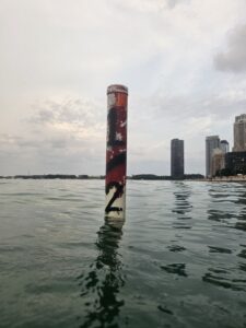 Distance marker showing a half mile 0.8km swim from the sand at Ohio Street Beach