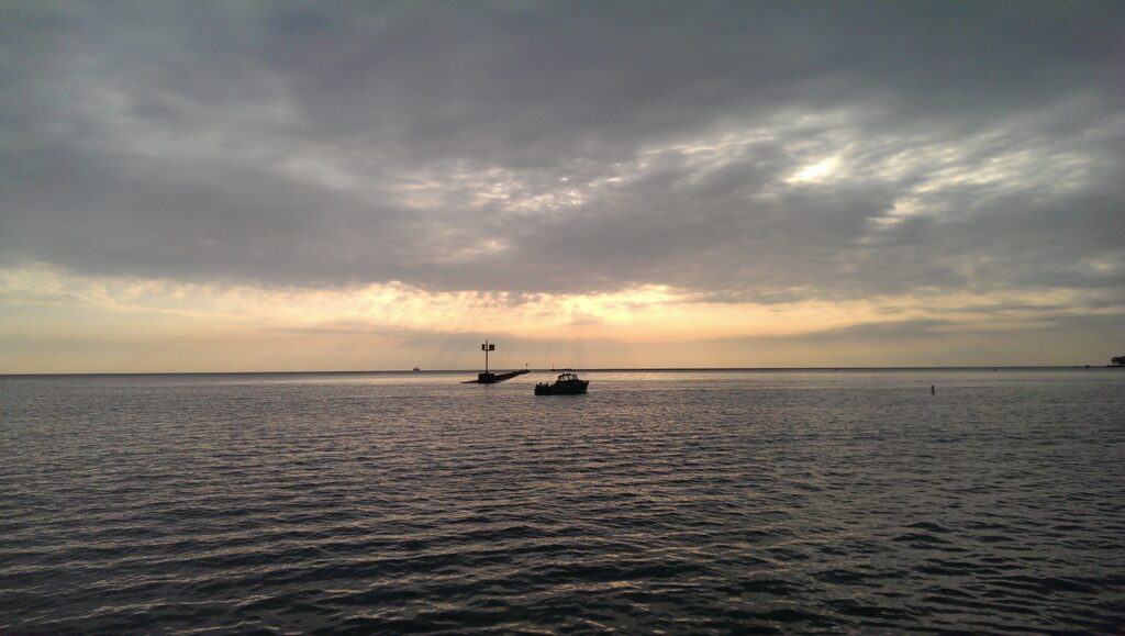 Tranquil water and sunrise over ohio street beach in Chicago 