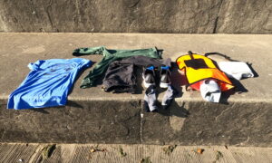 Size 45EU / 11US mens shoes, socks, t-shirt, hoodie, joggers, towel, waterproof phone case, and phone all fit in this open water swim buoy / tow float for open water swimming in cold water temperatures. 