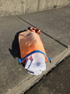 full size beach towel into the New Wave Open Water swim buoy