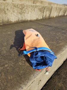 Small backpack fits in the New Wave Open Water Swim Buoy